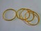 Golden bangles on white background