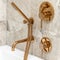 Golden bathtub faucet and shower handle, close-up
