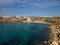 Golden Bay Malta aerial at distance and Radisson Blue resort on the cliff