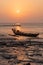 Golden beaches and fishing boats on the beach at dusk