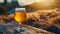 Golden Beer on Weathered Wooden Tabletop with Blurred Natural Landscape