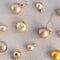 Golden and beige decoration balls pattern on neutral beige linen background. Aesthetic minimalist business branding or