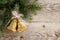 Golden bells with bow on wood