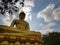 Golden big Buddha statue (Phra Buddha Dhammakaya Thep Mongkol) in Wat Pak Nam Phasi Charoen temple.