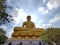 Golden big Buddha statue (Phra Buddha Dhammakaya Thep Mongkol) in Wat Pak Nam Phasi Charoen temple.