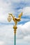 Golden bird statue on the top of pole