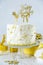 Golden birthday concept - cake, presents, decorations