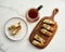 Golden Biscotti or Cantuccini on white plate on the white marble background.Traditional Sweet Italian cookies, two times