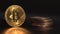 Golden Bitcoin BTC with reflection on the glass. Many oher crypto coins appea one after another in frame Black