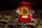 Golden bitcoin in car-shaped gift box for jewelry on the one hundred dollar bills