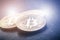 Golden bitcoin coins on a dark background with reflection. Virtual currency. Crypto currency. New virtual money. Lens flare