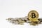 Golden bitcoin over many international money coins isolated on white background.  Crypto currency concept.  Bitcoin cryptocurrency