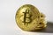 Golden bitcoin - shiny coin on a white background