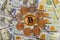 Golden Bitcoin on US dollars digital currency with US one dollar coins