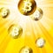 Golden bitcoins in the bright yellow rays of sun effect backgro