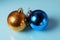 Golden and blue christmass balls on a glass background
