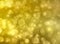 Golden bokeh abstract light background.