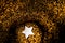 Golden bokeh background with vortex swirl and stars