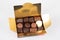 Golden box fine variety dark milk chocolate pralines candies in little gift carton
