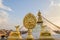 Golden brahma symbol in front of Bodhnath stupa