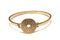 A golden brass bronze bracelet bangle with a patterned disc