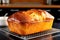 golden bread loaf fresh from oven on cooling rack