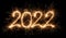 Golden bright modern sparkler number 2022 isolated black. happy new year eve silvester celebration background