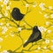 Golden bright yellow oriental seamless pattern with vintage birds and sakura tree branches.