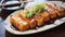 Golden brown chicken katsu drizzled with tonkatsu sauce, accompanied by a light shredded cabbage salad and rice.