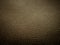 Golden brown faux leather texture for backgrounds and textures.