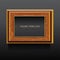 Golden and brown wooden classic frame on dark background