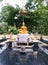 Golden buddha and disciples statue in the park.