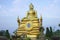 Golden Buddha sculpture. Beautiful religious sculpture in the garden.