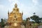 Golden Buddha sculpture. Beautiful religious sculpture in the garden.