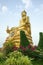 Golden Buddha sculpture. Beautiful religious sculpture in the garden.