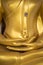 Golden Buddha sculpture body part