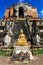 The Golden Buddha Statue in front of the broken pagoda