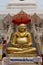 Golden Buddha statue in front of the Wat Phra That Chedi in Nong Khai, Thailand.