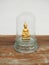 Golden Buddha statue in glass covering