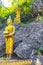 Golden buddha statue Phousi Hill Wat Chom Si Luang Prabang