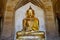 Golden Buddha statue at the Thatbyinnyu Temple in Bagan, Myanmar