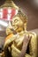 The golden Buddha statue.View of buddha statue in Thailand.Close up hand of statue Buddha.buddhism concept