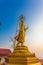 golden buddha statues on the high mountain