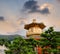 Golden buddhism tower with sky and light