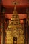 Golden Buddhist statues and carving showing intricate details and textures created by Buddhist monks around the world