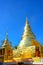 Golden Buddhist temple, shiny golden pagoda at Wat Pra Sing with blue sky background, Chiang-mai province northern of Thailand