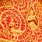Golden budha on red background