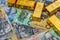 Golden bullion at australian dollar banknotes close up