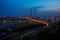 Golden cable-stayed bridge road car traffic from above. Modern Vladivostok Russia night illumination