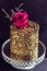 Golden cake with the rose on top